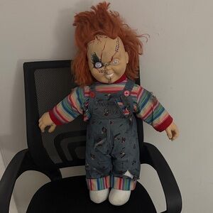 Spencer's Mischievous Doll with Striped Outfit